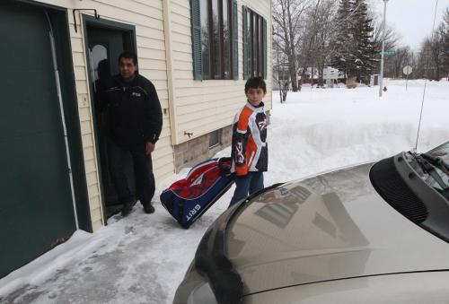 Warrod, Minnesota- 9 year old Daimon Gardner  leaves his home with his father Vince to the rink from their home in Warrod, Minnesota . He plays on the  Warrod squirt a team-See Randy Turners hockey FYI  story- January 29, 2013   (JOE BRYKSA / WINNIPEG FREE PRESS)