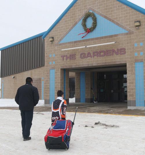 Warrod, Minnesota- 9 year old Daimon Gardner  arrives at the rink in Warrod, Minnesota  with his father Vince. He plays on the  Warrod squirt a team-See Randy Turners hockey FYI  story- January 29, 2013   (JOE BRYKSA / WINNIPEG FREE PRESS)