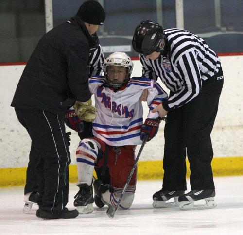 Warroad, Minnesota- 9 year old Daimon Gardner from the Warrod squirt a team in pain after he injured his foot in a crash  His team was taking on the team from Hallock, Minnesota-See Randy Turners hockey FYI  story- January 29, 2013   (JOE BRYKSA / WINNIPEG FREE PRESS)