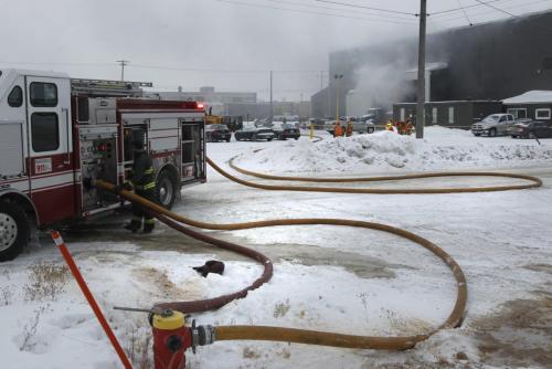 Winnipeg Fire Fighters at the scene of a fire at EJR Reload Wednesday morning, the warehouse is  located at 250 Sutherland Ave. Randy Turner story. (WAYNE GLOWACKI/WINNIPEG FREE PRESS) Winnipeg Free Press  Jan.30  2013