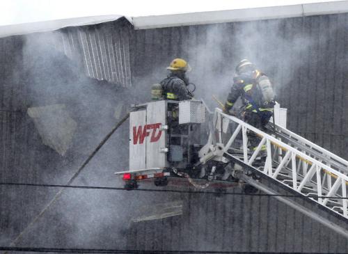 Winnipeg Fire Fighters at the scene of a fire at EJR Reload Wednesday morning, the warehouse is located  at 250 Sutherland Ave. Randy Turner story. (WAYNE GLOWACKI/WINNIPEG FREE PRESS) Winnipeg Free Press  Jan.30  2013