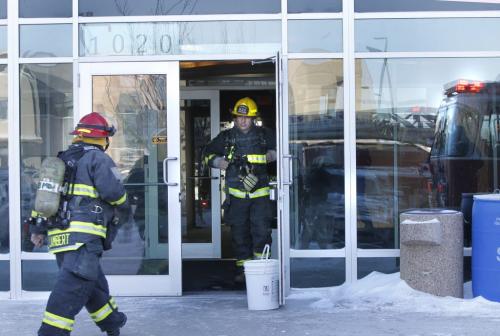 Winnipeg Fire Fighters attend the Western Surgery Centre on Lorimer Blvd. Thursday after reports of high CO2 readings. (WAYNE GLOWACKI/WINNIPEG FREE PRESS) Winnipeg Free Press  Jan.31  2013