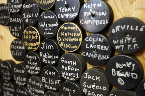 Donour puck wall to people who donated to the arena project- Jp Bend Memorial Arena in Poplar Point , organizers are  preparing 100 Years of Hockey Celebration and fund raiser Feb 8 . - Bill Leslie  was a player on the 1956-57 Provincial Championship team , Perry Dickenson ' dad played on the same team  are helping to organized  fundraiser   event to support the arena & local  hockey history displays Äì ashley prest story  KEN GIGLIOTTI / JAN. 31 2013 / WINNIPEG FREE PRESS