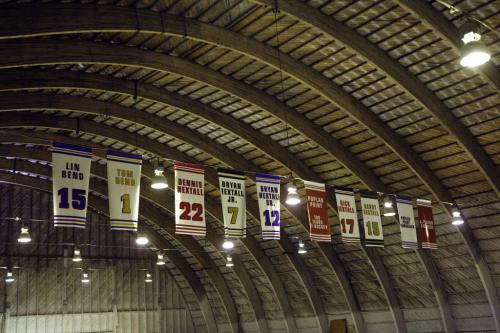 Banners hang in the old arena to former players - Jp Bend Memorial Arena in Poplar Point , organizers are  preparing 100 Years of Hockey Celebration and fund raiser Feb 8 . - Bill Leslie  was a player on the 1956-57 Provincial Championship team , Perry Dickenson ' dad played on the same team  are helping to organized  fundraiser   event to support the arena & local  hockey history displays Äì ashley prest story  KEN GIGLIOTTI / JAN. 31 2013 / WINNIPEG FREE PRESS