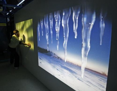 Zoo worker Bran Adams  (Bran is correct)  works interactive wall , interactive Icicles  play musical notes and the music  is used when  using hand movements to make  the  Northern Lights  to  move in the sky - KEN GIGLIOTTI / FEB 1 2013 / WINNIPEG FREE PRESS he iceles  play musical notes , the Assiniboine Park Conservancy  opens one-of-a kind Arctic themed indoor play area , restaurant , and gift shop , the Tundra Grill , Polar Playground  and Arctic Treasures Gift Shop  will form  an integral part of the Journey to Churchill Polar Baer exhibit  to open 2014 KEN GIGLIOTTI / FEB 1 2013 / WINNIPEG FREE PRESS