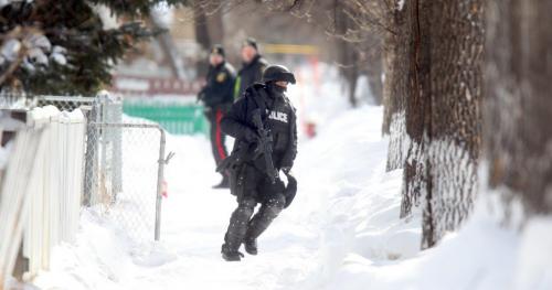 Police TAC teams and city fire and ambulance crews surrounded a home in the 500 block of Simcoe street Friday afternoon after a man broke into a home then barracaded homself in after police arrived. See webbie. Feb 1, 2013 - (Phil Hossack / Winnipeg Free Press)