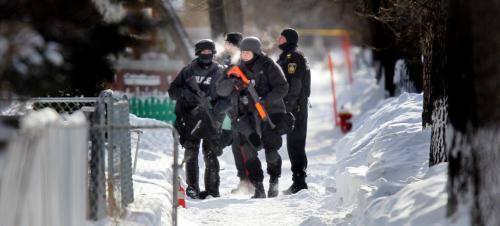Police TAC teams and city fire and ambulance crews surrounded a home in the 500 block of Simcoe street Friday afternoon after a man broke into a home then barracaded homself in after police arrived. See webbie. Feb 1, 2013 - (Phil Hossack / Winnipeg Free Press)