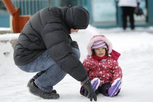 Corey Bickerton, teaching Kalia, 3, how to skate during her second attempt at the rink at The Forks, Saturday, February 2, 2013.(TREVOR HAGAN/ WINNIPEG FREE PRESS)