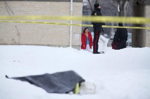 Winnipeg Police at a Manitoba Housing complex on Doncaster Street where a body was found Saturday, February 2, 2013. (TREVOR HAGAN/WNNIPEG FREE PRESS)