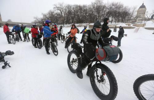 Lindsay Gauld, stopped in front of the Legislative building on his way along the Red River and past 1,000,000km's total on his bicycle, Saturday, February 2, 2013. (TREVOR HAGAN/WNNIPEG FREE PRESS)