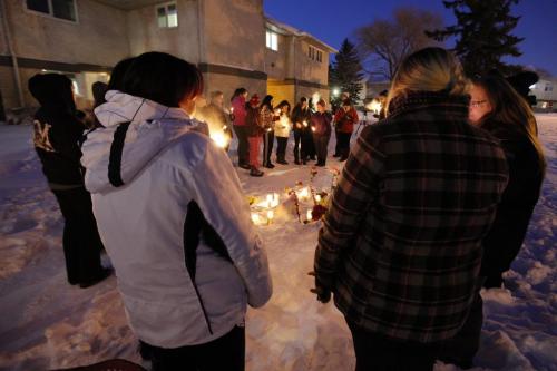 February 3, 2013 - 130203  -  Friends and family attend a vigil for Nadia Fiddler in the courtyard of a Manitoba Housing complex on Doncaster. Although not confirmed by police it is alleged that Fiddler was found dead in the courtyard Saturday February 2 2013. John Woods / Winnipeg Free Press