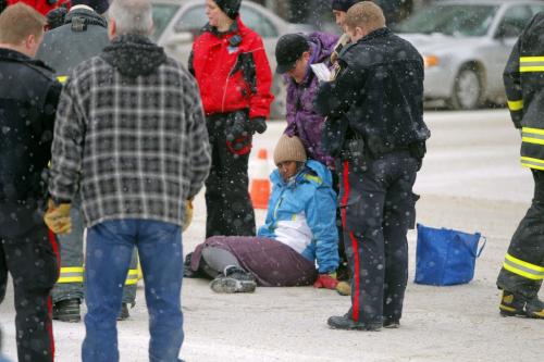 A woman is struck down by a car on Ellice and Smith. Police were talking to a taxi driver on scene. Not known what happened. Please check city desk. Feburary, 4 2013  BORIS MINKEVICH / WINNIPEG FREE PRESS