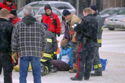 A woman is struck down by a car on Ellice and Smith. Police were talking to a taxi driver on scene. Not known what happened. Please check city desk. Feburary, 4 2013  BORIS MINKEVICH / WINNIPEG FREE PRESS