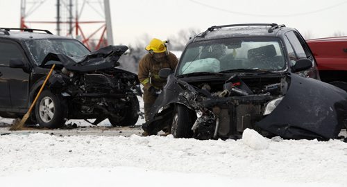 3 car mvc westbound Perimeter Hwy between Main St and McPhillips , a car and a truck both went off the road on opposite east lane and  westbound service rd near the MVC in unrelated  icy conditions . One person  and possibly 2 more are injured , one car had both front and rear damage - west bound closed , tiow trucks on scene  KEN GIGLIOTTI / FEB 5 2013 / WINNIPEG FREE PRESS