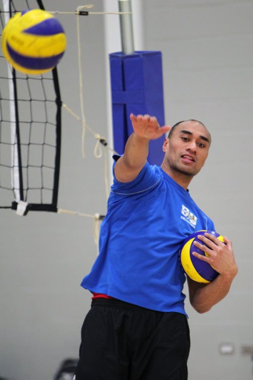 Brandon Sun 04022013 Sam Tuivai of the Brandon Bobcats hits volleyballs during practice at the BU Healthy Living Centre on Monday evening. (Tim Smith/Brandon Sun)