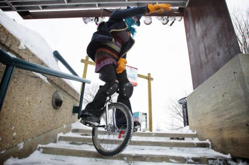 Evie Henry, 20, practices her unicycle skills at The Forks Tuesday afternoon despite the cold weather. She bought the unicycle around six months ago after getting tired of having her bicycle always being stolen.   130205 February 5, 2013 Mike Deal / Winnipeg Free Press