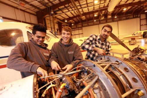 Business - Students with the Aviation and Aerospace program at Red River College work on engines at the Stevenson Campus on Saskatchewan Ave. with the Academic Coordinator - Christopher Walters.   See Martin cash  story on foreign students in program. Names  from right - Rajat  Arova (plaid, from India), Michael Mitchell and Alden Foncesca from India. Feb 05, 2013, Ruth Bonneville  (Ruth Bonneville /  Winnipeg Free Press)