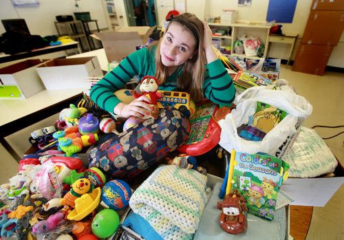 Thirteen year old Mackenzie, a grade 8 student at Windsor School took it upon herself to rally up her fellow students in her K -  8  school to donate baby items for a orphanage in Uganda. After hearing that Free Press staff photographer Ruth Bonneville was heading to Watoto, a baby orphanage in Gulu  Africa   she asked if she could help by collecting  needed items for the kids.  Mackenzie has been active in "We Day" activities which encourage students all over Manitoba to find ways to give back to others. She put together a  letter for the students to take home and made presentations to her fellow students on the needs of the baby's in the orphanage In just a few weeks over 12 boxes were collected, everything from diapers to toys ans books.  The items were loaded up Tuesday afternoon to be packed in large duffle bags and sent with the group of volunteers from her church when they leave for Uganda on Saturday,Feb 16. Mackenzie is one of students in the 2017 project.

  Feb 05, 2013, Ruth Bonneville  (Ruth Bonneville /  Winnipeg Free Press)