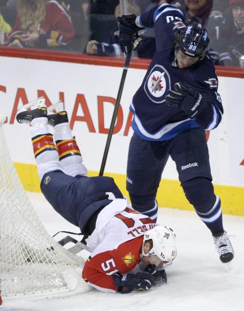 Winnipeg Jets Nik Antropov upends  Florida Panthers Brian Campbell during first period NHL action at the MTS Centre in Winnipeg Tuesday night -See Ed Tait, Tim Campbell stories- February 05, 2013   (JOE BRYKSA / WINNIPEG FREE PRESS)
