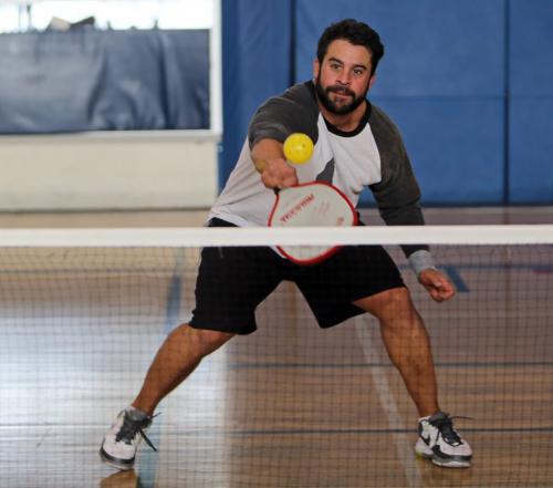 Adamo Rondinella plays Pickle Ball, a life size version of table tennis that requires at least 2 people, at the Wellness Institute located at Seven Oaks Hospital, February 6, 2013. (TREVOR HAGAN/WINNIPEG FREE PRESS)