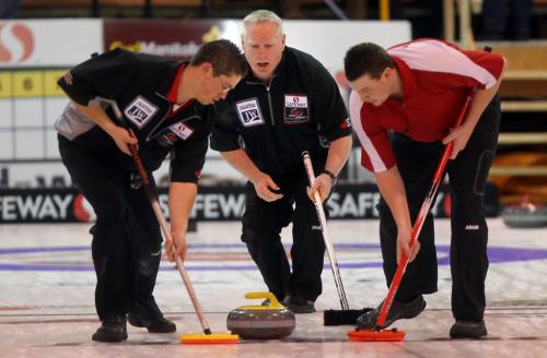 Terry McNamee's 2nd Travis Taylor (left) and lead Travis Saban keep the rock clean in the morning draw at the Safeway Championship in Neepawa. See Paul Weicek story. February 7, 2013 - (Phil Hossack / Winnipeg Free Press)