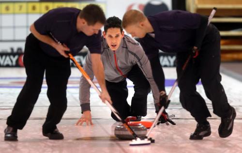 Brendan Taylor keeps his sweepers in motion during the morning draw at the Safeway Championship in Neepawa. See Paul Weicek story. February 7, 2013 - (Phil Hossack / Winnipeg Free Press)