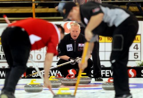 Terry McNamee howls instruction to Travis Saban (left) and Steve Irwin as they sweep during the morning draw at the Safeway Championship in Neepawa. See Paul Weicek story. February 7, 2013 - (Phil Hossack / Winnipeg Free Press)