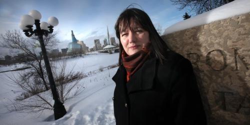 My Winnipeg's Jackie Shymanski poses at one of her favorite "vistas" on Tache, looking across the Red River at downtown Winnipeg. February 8, 2013. - (Phil Hossack / Winnipeg Free Press)