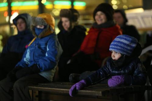 David Howes, 6, watches one of 5 short hockey films outside being projected on a snow screen at The Forks, Friday, February 8, 2013. (TREVOR HAGAN/WINNIPEG FREE PRESS)