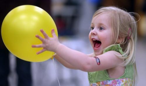 Erin Esleifson, 2, plays with a balloon at the Winter Carnival at Varsity View Community Centre, Saturday, February 9, 2013. (TREVOR HAGAN/WINNIPEG FREE PRESS)