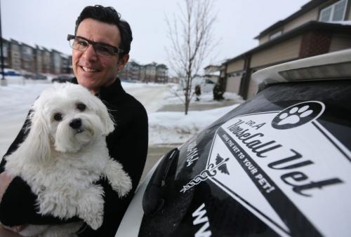 Dr. Larry Adelman, and his dog, Maggie, next to his house-call veterinary service vehicle, Saturday, February 9, 2013. (TREVOR HAGAN/WINNIPEG FREE PRESS) - for carolin vesely story - pet euthanasia