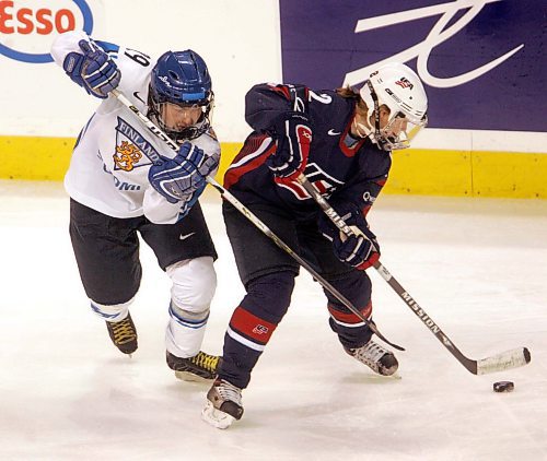 BORIS MINKEVICH / WINNIPEG FREE PRESS  070408 USA vs. FINLAND WOMENS HOCKEY  First Period Fin #29 Karoliina Rantamaki and USA #12 Jenny Potter tangle up.