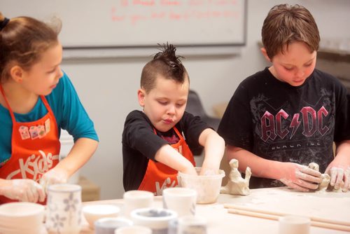 Brandon Sun Sean Taron, centre, got his hands dirty, along with sister Brooklyn, left, and Chance Vidito, right, during Saturday's pottery and clay creation at Brandon University. The hands-on workshop was part of the university's Winterlude celebrations that were held on campus. (Bruce Bumstead/Brandon Sun)