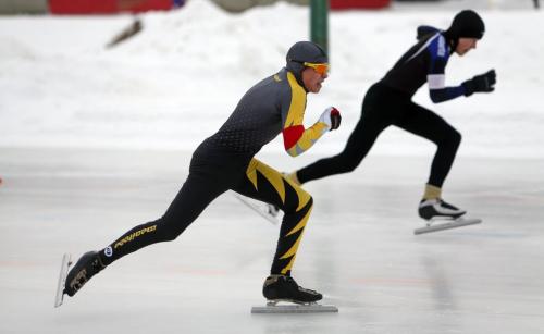 Team Manitoba's Carter Chambers, 15, , left, competes against Ryan Dodyk, from Alberta, in the 100m event at the provincial long track speed skating on the Susan Auch Oval at the Cindy Klassen Rec Centre, Sunday, February 10, 2013. (TREVOR HAGAN/WINNIPEG FREE PRESS)