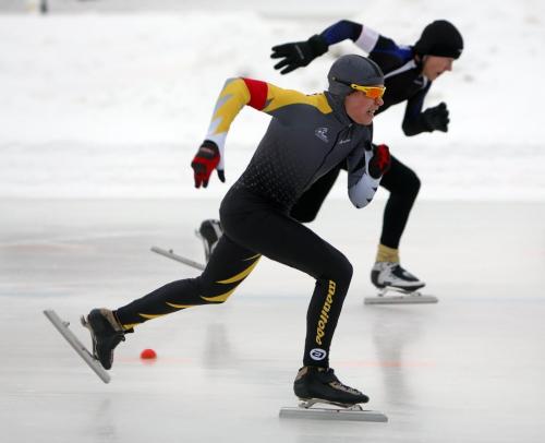 Team Manitoba's Carter Chambers, 15, left, competes against Ryan Dodyk, from Alberta, in the 100m event at the provincial long track speed skating on the Susan Auch Oval at the Cindy Klassen Rec Centre, Sunday, February 10, 2013. (TREVOR HAGAN/WINNIPEG FREE PRESS)