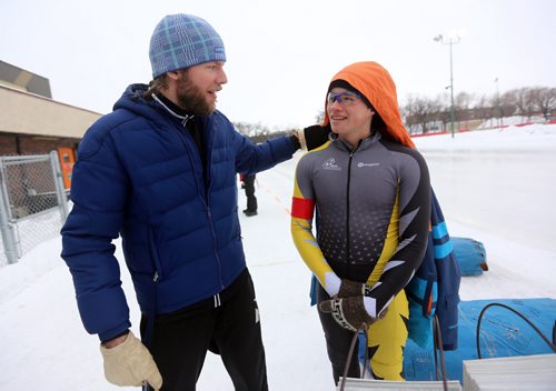 Manitoba Provincial Team Coach, Remmelt Eldering, speaking with Harrison Jones, 15, at the provincial long track speed skating championships on the Susan Auch Oval at the Cindy Klassen Rec Centre, Sunday, February 10, 2013. (TREVOR HAGAN/WINNIPEG FREE PRESS)