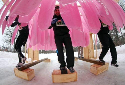 Participants make their way through the "Lick the Pole" obstacle during the Ice Donkey run at the University of Manitoba, Sunday, February 10, 2013. (TREVOR HAGAN/WINNIPEG FREE PRESS)