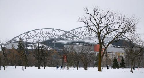 Participants make their way through the snow, during the Ice Donkey run, in front of Investors Group Field at the University of Manitoba, Sunday, February 10, 2013. (TREVOR HAGAN/WINNIPEG FREE PRESS)