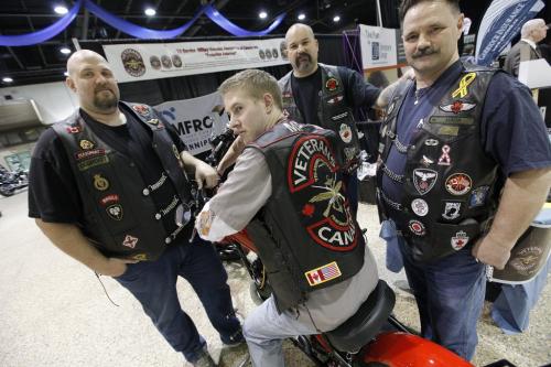 February 10, 2013 - 130210  -  Photographed at the Mid-Canada PowerSport Show at the Convention Centre (L to R) Paul de Groot, Will Lee, Mark Vandersteen and Dave MacKenzie all from the Tri Service Military Veterans Association of Canada Inc., are putting a fundraising social for Pauls brother, Tony de Groot, this coming Friday February 15 to help raise funds for Tony who was recently diagnosed with stage 3b colon cancer. De Groot is 43, married with three young children, two of whom are autistic.. John Woods / Winnipeg Free Press