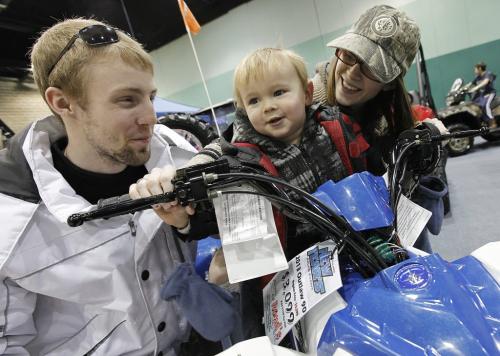 February 10, 2013 - 130210  -  Photographed at the Mid-Canada PowerSport Show at the Convention Centre (L to R) Mike Weremchuck, Lisa Heintzman and Wyatt Heintzman try out a new ATV Sunday February 10, 2013. John Woods / Winnipeg Free Press