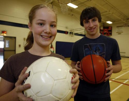 We Day  students  organize a campaign  to have schools  use only fair trade  sports equipment  not made by child labour Äì in pic Gr. 8 students LtoR Äì Eva Rodrigues  and Jack Osiowy  are part of a  group organizing the  campaign.  KEN GIGLIOTTI / FEB 11 2013 / WINNIPEG FREE PRESS