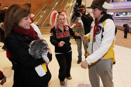 February 11, 2013 - 130211  -  Kristin MacCuish (C) welcomes Matt Dunstone and his junior curling gold medal team home as Dunstone's mother Wendi and Scooter look on Monday February 11, 2013.  John Woods / Winnipeg Free Press