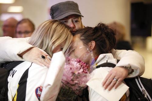 February 11, 2013 - 130211  -  Sheila Mondor comforts her daughter and another team member of the Shannon Birchard junior curling silver medal team after they were welcomed home by family and friends Monday February 11, 2013.  John Woods / Winnipeg Free Press
