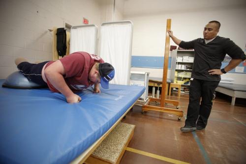 October 19, 2012 - 121019 - Cole Maydanuk works with his therapist Ron Recuencoat a physiotherapy session at HSC Friday October 19, 2012. Maydanuk, the eldest son of Kim and Darryl Maydanuk was in a tragic workplace accident at the CN rail yards in Brandon on July 25, 2012 which resulted in the loss of both of his legs. John Woods / Winnipeg Free Press