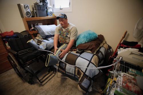 October 26, 2012 - 121026  -  In his bedroom Cole Maydanuk puts on  compression stockings to reduce the amount of fluid in his stumps Friday October 26, 2012. Maydanuk, the eldest son of Kim and Darryl Maydanuk was in a tragic workplace accident at the CN rail yards in Brandon on July 25, 2012 which resulted in the loss of both of his legs.  John Woods / Winnipeg Free Press