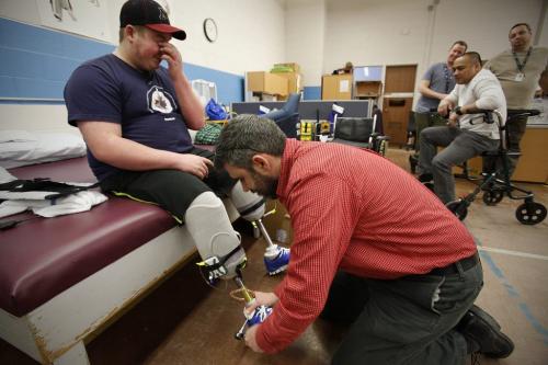 December 14, 2012 - 121214  -  Cole Maydanuk walks with his first set of legs and works with his therapist Ron Recuencoat a physiotherapy session at HSC Friday December 14, 2012. Maydanuk, the eldest son of Kim and Darryl Maydanuk was in a tragic workplace accident at the CN rail yards in Brandon on July 25, 2012 which resulted in the loss of both of his legs.  John Woods / Winnipeg Free Press