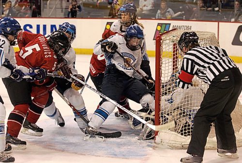 BORIS MINKEVICH / WINNIPEG FREE PRESS  070409 CANADA vs. FINLAND WOMENS HOCKEY  Second Period. A scramble in front of the net.