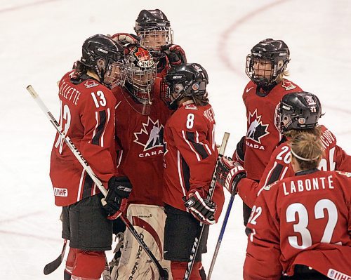 BORIS MINKEVICH / WINNIPEG FREE PRESS  070409 CANADA vs. FINLAND WOMENS HOCKEY  Third Period. Team Canada goalie Kim St-Pierre is congratulated after the game ended.