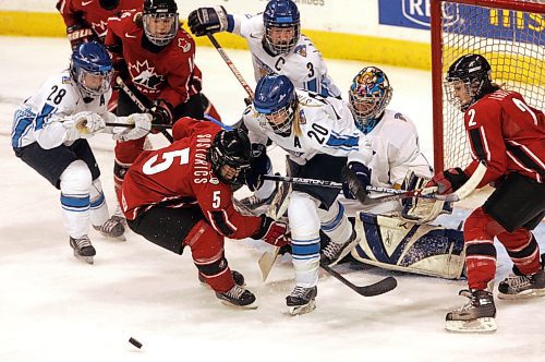 BORIS MINKEVICH / WINNIPEG FREE PRESS  070409 CANADA vs. FINLAND WOMENS HOCKEY  Third Period. Canada #5 Colleen Sostorics and #20 Saija Sirvio.