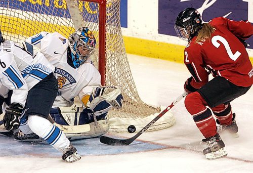 BORIS MINKEVICH / WINNIPEG FREE PRESS  070409 CANADA vs. FINLAND WOMENS HOCKEY  Third Period. Canada #2 Meghan Agosta tries to put one past Finland goalie #1 Noora Raty.